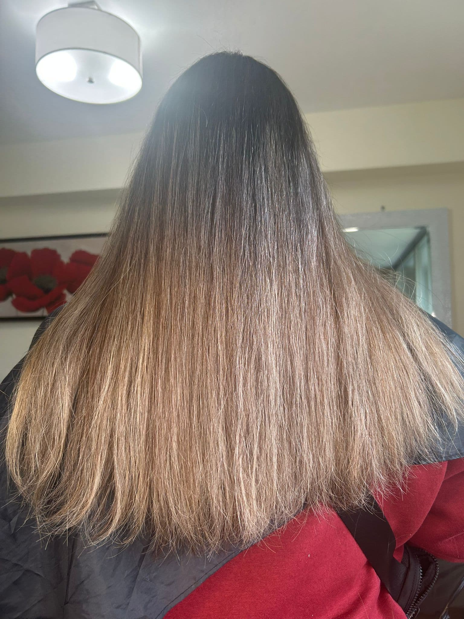 Hair Botox result: long, smooth hair with a soft honey-blonde finish